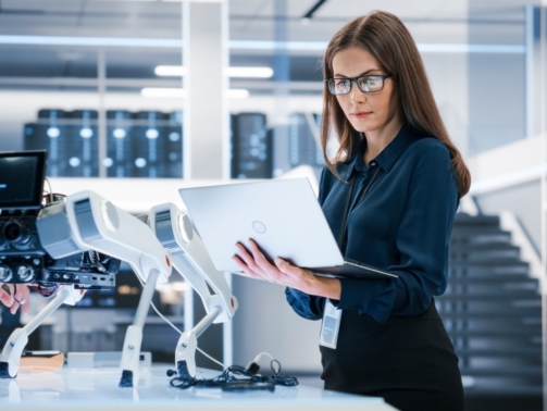 Portrait,Of,A,Young,Robotics,Engineer,Using,Laptop,Computer,,Analyzing