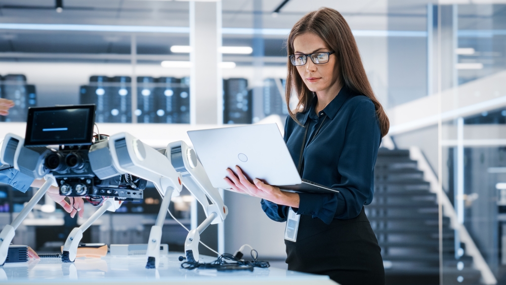 Portrait,Of,A,Young,Robotics,Engineer,Using,Laptop,Computer,,Analyzing